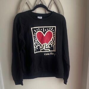 Keith Haring black sweatshirt featuring  "Figures Holding a Heart" graphic med